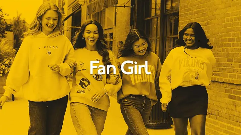 A model in a black hoodie and purple patterned pants, from the Fan Girl Collection Reel