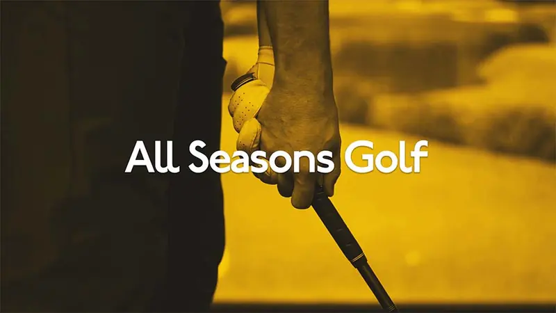 A golfer swinging in an indoor simulator, from the All Seasons Golf Parade of Homes video